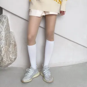 Detail view of fake knee-high pantyhose with stylish spliced design for sweet cool outfits.
