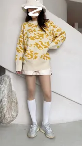 Sweet and cool style fake thigh high socks matched with abstract pattern knit sweater.