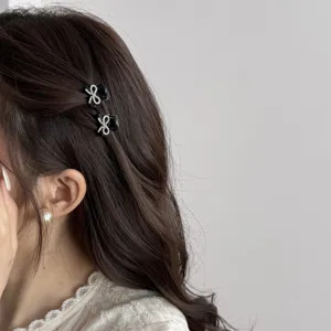 Mini black bow hair claw clips set rhinestone side hairpins cute hair accessories detail view.