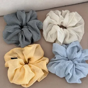 Chiffon gingham hair scrunchies detail view, soft pleated vintage ponytail holder hair accessories.