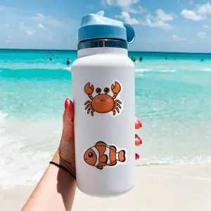 Insulated water bottle featuring cute cartoon crab and clownfish waterproof stickers beach backdrop