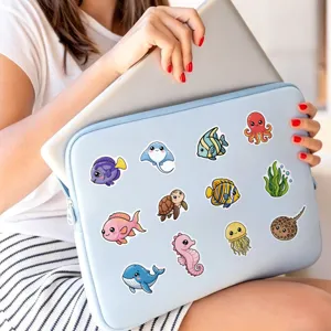 Cute ocean animal stickers applied on laptop sleeve, showing waterproof vinyl waterproof cute decor.