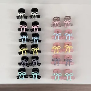 Cute mini bow hair claw clips set in pastel and black colors, perfect for sweet hair styling.