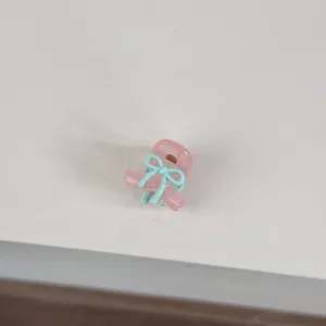 Mini bow hair claw clip, sweet Korean style cute hair accessory for bangs and side hair styling.
