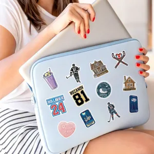 Close-up detail of waterproof ice hockey romance theme decorative stickers on laptop sleeve.