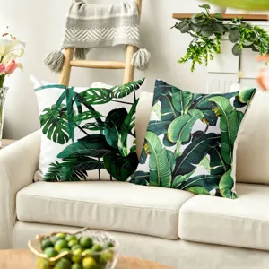 Close-up detail of tropical plant printed throw pillowcase, showcasing vibrant green foliage design.