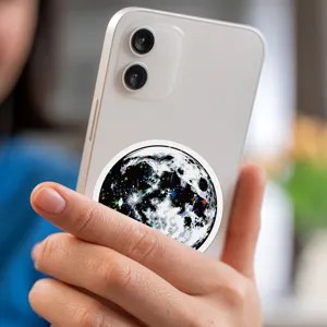Millennium graffiti sticker featuring a star and moon design, showcased on a white phone.