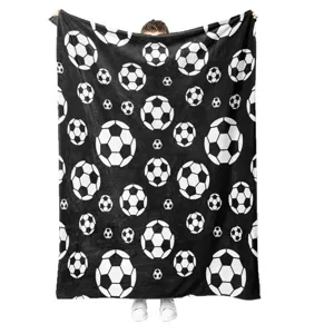 Black and white soccer ball printed flannel blanket, soft and cozy fleece throw for home use.