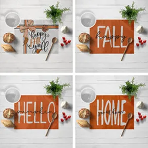 Set of 4 autumn placemats with pumpkin and fall themed typography, rustic farmhouse table decor.