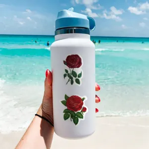 Insulated white water bottle decorated with charming vintage red rose botanical vinyl stickers.