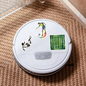 Detailed view of soccer themed decorative stickers featuring players and pitch on white surface.