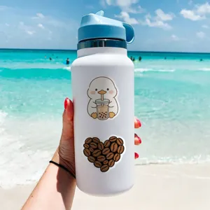 Water bottle detail view featuring cute aesthetic duck and coffee bean stickers outdoors.