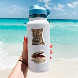 Detailed view of waterproof decorative stickers applied on a white water bottle at sunny beach.