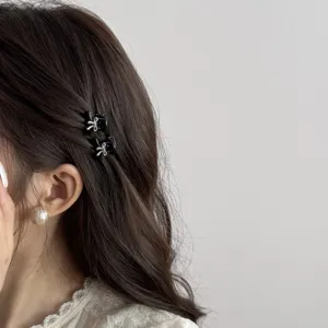 Mini black hair claw clips with silver bowknot for cute side hair styling daily wear.
