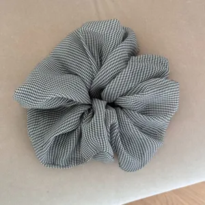 Black and white gingham chiffon hair scrunchie, retro ruffled pony tail holder.
