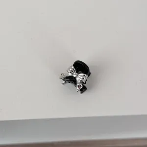 Mini black bow hair claw clip detail shot, elegant silver bow design for cute hairstyles.