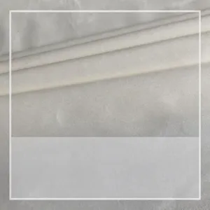 White Netherlands velvet fabric material soft comfortable texture home textile cloth close up