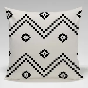 Closeup of black and white geometric pixel pattern pillowcase, modern minimalist sofa cushion.