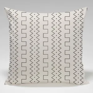Modern minimalist geometric throw pillow cover detail, black and white zigzag pattern print.