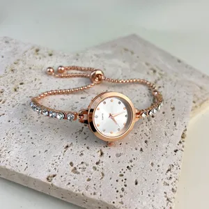 Detailed view of an elegant rose gold rhinestone bracelet quartz watch for women, delicate charm.