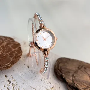 Exquisite rose gold quartz watch with sparkling rhinestones, delicate bracelet design for women.