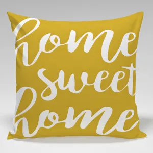 Fodera per cuscino decorativa gialla con scritta bianca Home sweet home in corsivo elegante.