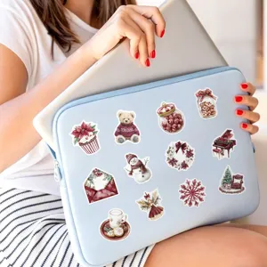 Close-up details of burgundy Christmas aesthetic stickers showcasing cute watercolor holiday designs.