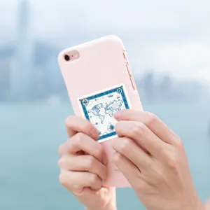 Close-up detail of vintage nautical map sticker on phone case, perfect outdoor travel decor.