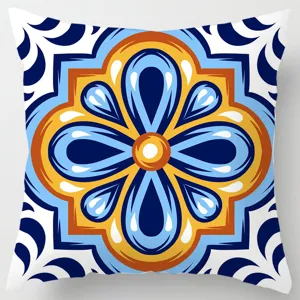 Detailed close-up of decorative throw pillow cover featuring geometric ethnic floral tile pattern.