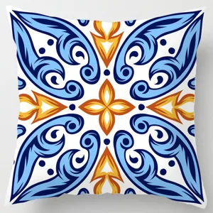 Close-up detail of geometric blue and orange tile pattern pillowcase for home decor.