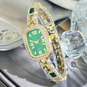 Womens rhinestone quartz watch with green rectangular dial and luxury crystal bracelet design.