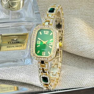 Close-up detail of the luxury green dial quartz watch with sparkling rhinestones and gold strap.