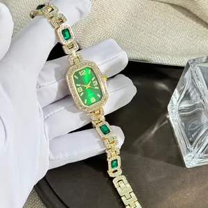 Elegant women's quartz watch featuring an emerald green dial, crystal-studded case, and gem bracelet.