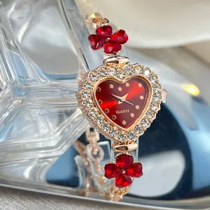 Women's quartz watch featuring a red heart dial, sparkling rhinestones, and elegant clover charms.