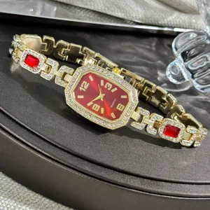 Women's gold quartz watch with red dial, rhinestone bezel and gemstone bracelet link.