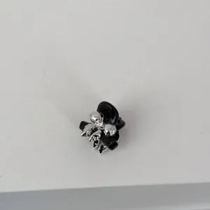 Mini black and silver bow hair claw clip detail, perfect for sweet daily styling and bangs.