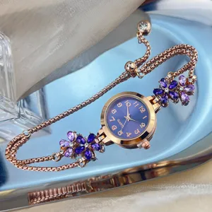 Close-up detail of women quartz bracelet watch with purple crystal flowers and rose gold.