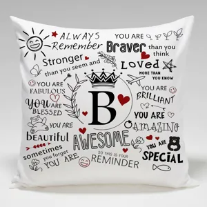 Funda de cojin blanca con citas motivacionales en ingles y letra B decorativa.