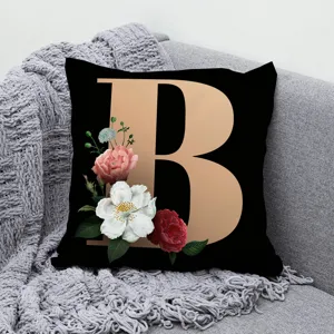 Decorative square throw pillow cover featuring a stylish gold letter B and floral print.