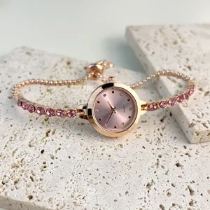 Exquisite rose gold quartz watch with pink crystal tennis bracelet strap and elegant dial.