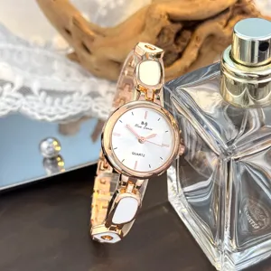 Damen unregelmäßige Armband Quarzuhr mit rundem Sonnenstrahl Zifferblatt, elegantes Design.