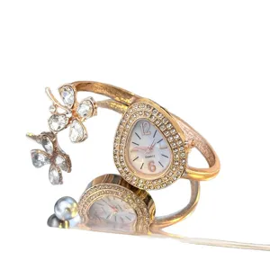 Luxury teardrop quartz watch with clover bangle bracelet for women elegant timepiece