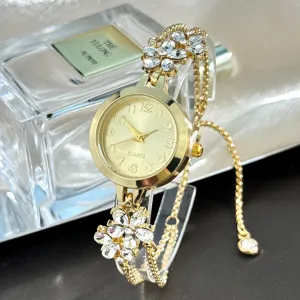 Gold quartz watch for women, sparkling crystal flower charms, sliding chain bracelet.