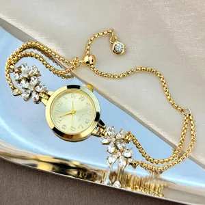 Elegant women quartz bracelet watch with sparkling crystal flower charms and adjustable slider chain.