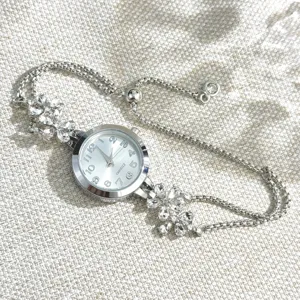 Silver rhinestone flower bracelet quartz watch for women, stylish pull-type adjustable chain.