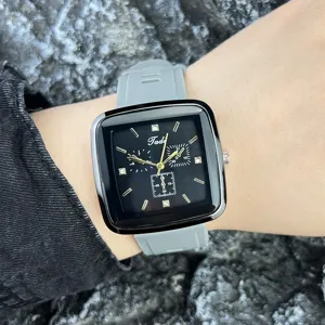 Modische Quarzarmbanduhr mit quadratischem Zifferblatt und grauem Silikonarmband für Damen.