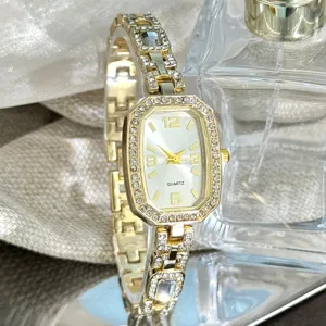 Elegant women quartz watch with rhinestone oval dial and fashionable gold chain strap.