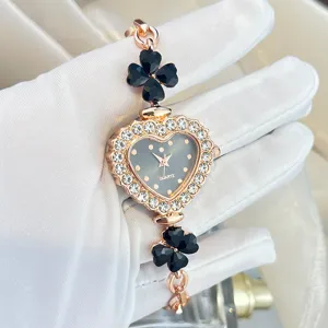 Women fashion quartz watch with heart dial and black clover charms elegant wrist watch