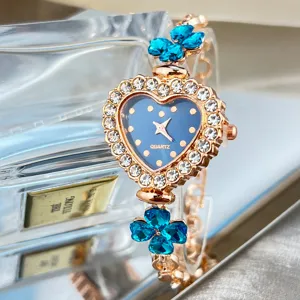 Heart dial quartz watch with blue crystal clovers and sparkling rhinestones for women stylish wrist.