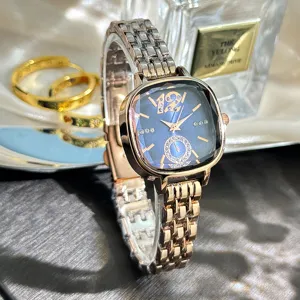 Luxury womens quartz watch with faceted blue square dial and elegant rose gold steel bracelet.